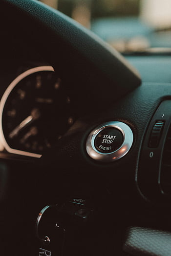 car interior, ignition, start stop button, luxury car, dashboard, sleek design, close-up, engine button, vehicle control, modern car, automotive design