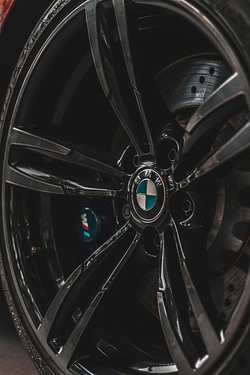 BMW wheel, black BMW rim, tire, brake disc, close-up, car wheel, automotive, car parts, vehicle, rim details, BMW logo