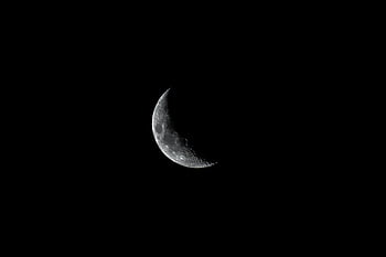 grayscale photo, crescent moon, dark night sky, detailed moon, captured over Morocco, moon photography, night sky, moon details, crescent moon photo, moon image, grayscale moon