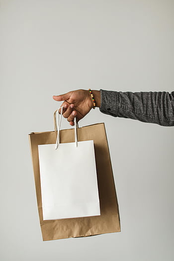 online shopping, paper shopping bags, stylish hand, seamless experience, white shopping bag, brown paper bag, hand holding bags, shopping experience, paper bags, online purchase, stylish shopping
