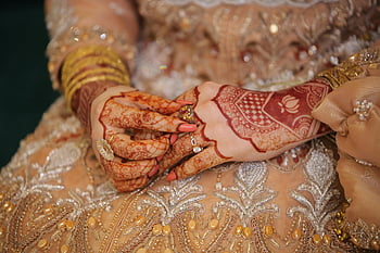 henna tattoos, bride hands, cultural elegance, detailed henna, elegant jewelry, wedding henna, traditional henna, bridal henna, henna design, close-up henna, henna art