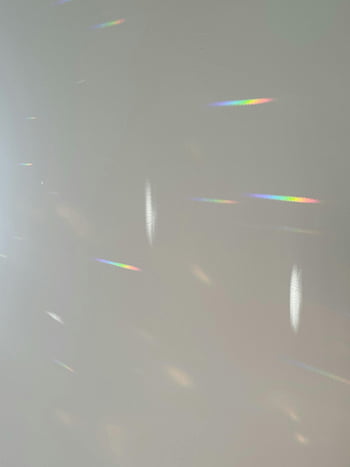 rainbow lights, wall reflections, soft rainbow, abstract effect, serene atmosphere, rainbow patterns, light reflections, wall art, rainbow colors, abstract wall, serene light