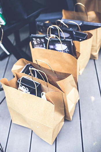 shopping bags, brown paper bags, retail themes, shopping items, collection of bags, filled bags, retail shopping, paper shopping bags, eco-friendly bags, shopping collection, retail display