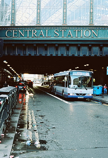 Glasgow, Central Station, city bus, street view, city road, urban transportation, public transport, Scotland, bus passing, underpass, wet pavement