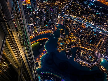 aerial photography, cityscape, nighttime, Dubai, illuminated skyscrapers, urban landscape, vibrant aerial, night city, modern architecture, city lights, aerial view