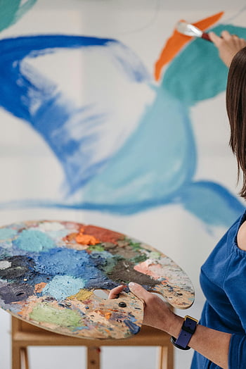 artist painting, colorful abstract mural, indoor painting, palette, close-up artist, mural painting, abstract art, indoor art, painting process, artist at work, colorful palette