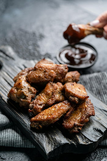 fried meat, wooden board, deep-fried chicken wings, BBQ sauce, rustic wooden board, delicious chicken wings, fried chicken, BBQ chicken wings, appetizer, finger food, party food