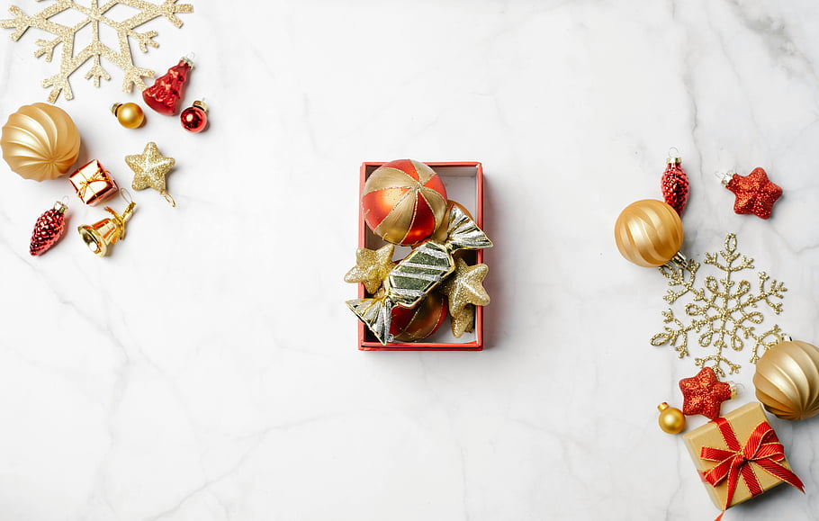 Christmas decorations, marble background, festive celebration, top view, colorful ornaments, holiday decor, Christmas ornaments, gold ornaments, red ornaments, snowflake decorations, gift box