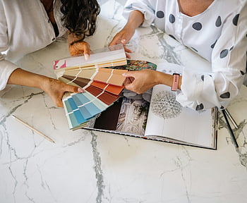 women, sample color chart, interior design, color palettes, office collaboration, design planning, color swatches, professional women, workspace, creative process, design consultation