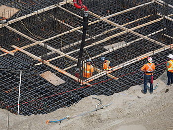 construction workers, construction site, steel foundation, building site, high angle view, reinforcing steel, construction equipment, safety gear, construction industry, construction activity, construction site workers