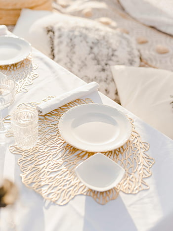 outdoor dining, white plates, glassware, elegant decor, stylish setup, outdoor table setting, white tableware, elegant table setting, outdoor elegance, white decor, outdoor dining setup