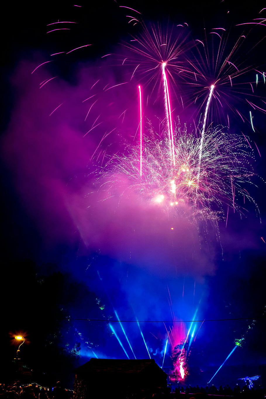 fireworks, exploding fireworks, colorful fireworks, night sky, vivid colors, smoke, mesmerizing spectacle, purple fireworks, blue fireworks, firework display, night fireworks