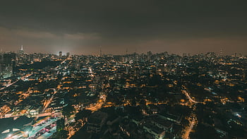 aerial photography, São Paulo skyline, nighttime city view, vibrant city lights, bird's eye view, urban landscape, aerial cityscape, nighttime aerial, city lights photography, São Paulo cityscape, stunning skyline
