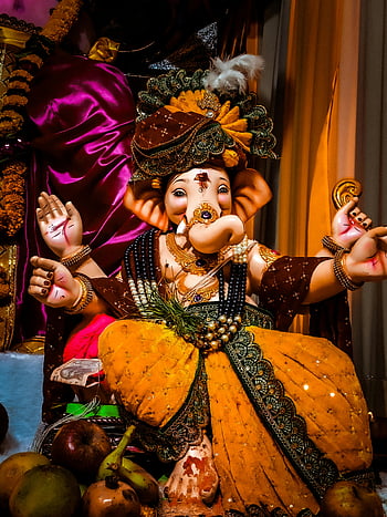 Ganesh statue, Ganesh idol, Ganesh Chaturthi, colorful Ganesh, decorated Ganesh, Hindu deity, religious statue, festive decoration, Indian festival, traditional idol, cultural celebration