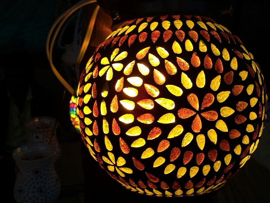 Black and Yellow Floral, Lighted Lamp, Colorful handmade lantern, intricate patterns, festive ambiance, warm ambiance, decorative lighting, floral design, handcrafted lamp, ornamental light, festive lighting