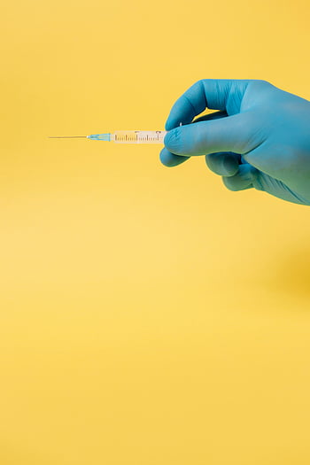 gloved hand, syringe, yellow background, close-up, medical, healthcare, injection, needle, blue gloves, medical equipment, vaccine