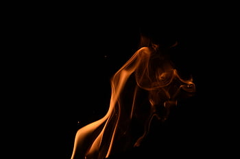 flame, orange flame, dark background, dramatic effect, artistic effect, fire photography, smoke, fiery, glowing, abstract, contrast