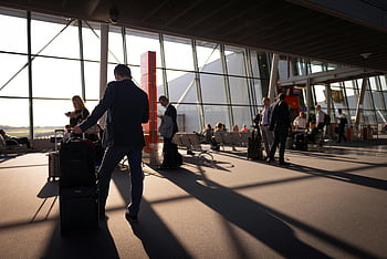 airport terminal, busy people, travelers, carry-on luggage, waiting for departure, bustling airport, airport travelers, airport scene, airport activity, airport passengers, luggage