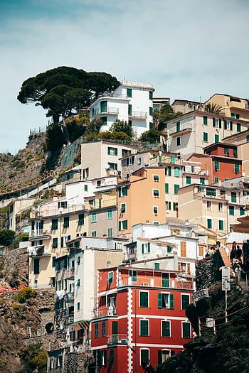 Cinque Terre, Riomaggiore, Liguria, Italy, vibrant houses, stacked houses, hillside village, picturesque view, colorful buildings, Mediterranean architecture, coastal town