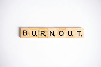 burnout, Scrabble tiles, white background, conceptual image, close-up shot, wooden tiles, word game, mental health, stress, exhaustion, work-related stress