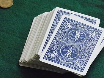 playing card deck, green felt table, gambling, game themes, stacked cards, poker, casino, card games, blue design, card backs, coin