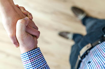 handshake, trust, cooperation, office, multicolored blazer, close-up, business, professional, partnership, agreement, collaboration