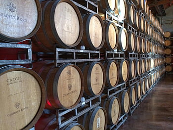 wine tank room, wooden wine barrels, Napa CA winery, wine production visuals, Chimney Rock, Cadus, wine aging, wine cellar, winemaking process, wine storage, wine barrels