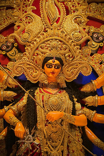 Goddess Durga, Kolkata Festival, Durga Puja, intricate idol, captivating view, golden idol, traditional festival, Indian culture, religious celebration, ornate decoration, cultural artistry