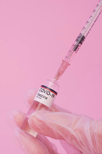 COVID-19 vaccine, vaccine preparation, syringe, vial, pink background, close-up, physician, gloves, medical, healthcare, vaccination