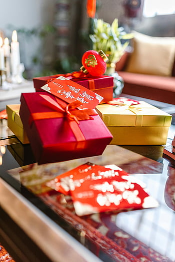 Chinese New Year, gifts, red and gold, decorations, table, vibrant, festive, holiday, presents, celebration, gift boxes