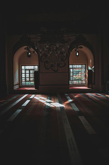 old mosque interior, arched windows, intricate chandelier, soft light, serene mosque, interior design, religious architecture, traditional mosque, cultural heritage, prayer space, historical building