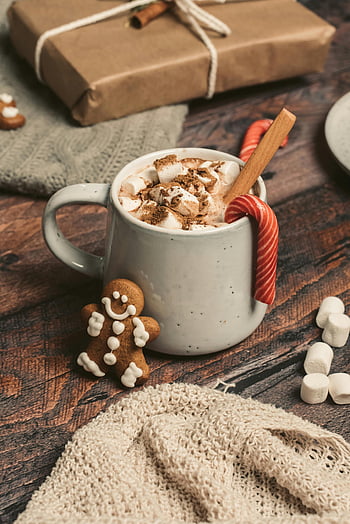 hot chocolate, mug, marshmallows, gingerbread, rustic table, candy cane, warm drink, cozy setting, winter beverage, festive drink, gift box