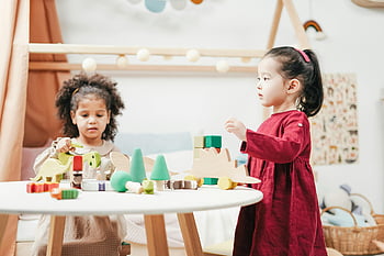 children playing, wooden toys, bright playroom, education themes, two children, engaging toys, playroom activities, educational play, child development, indoor play, toy interaction