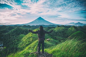 person standing on top of hill, Mt. Mayon, lush green hills, Bicol, Philippines, expansive view, volcano, nature, outdoor, travel, adventure