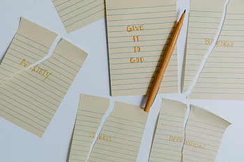 anxiety, stress, depression, give it to God, ripped notebook pages, pen, mental health, emotional well-being, handwritten notes, table, self-care