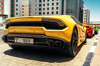 yellow Lamborghini, sports car, downtown Dubai, luxury car, speed, close-up photo, Lamborghini, yellow car, high-end vehicle, urban setting, performance car