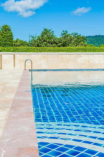 outside swimming pool, turquoise pool, clear blue sky, poolside scene, tranquil scene, outdoor pool, swimming pool, pool deck, pool railing, sunny day, greenery background