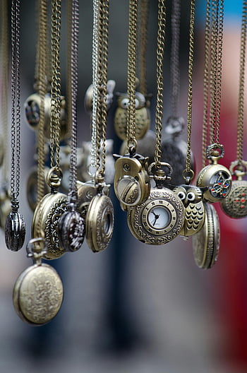 vintage pocket watches, ornate watches, gold watches, round pocket watches, hanging watches, chains, antique watches, collectible watches, decorative watches, timepieces, pocket watch collection