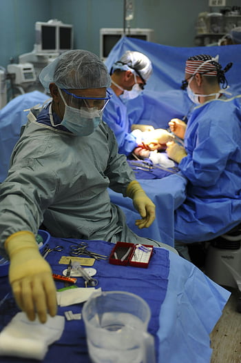 doctors, surgeons, operating room, surgery, medical team, hospital, surgical instruments, surgical gloves, surgical masks, medical procedure, medical staff