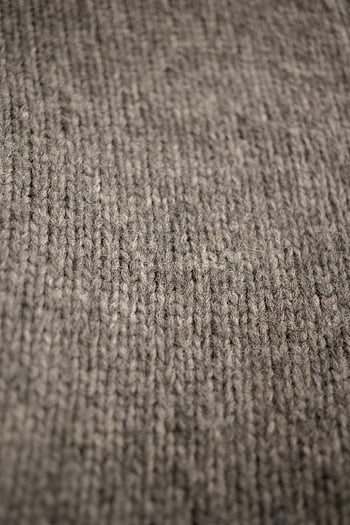 knitted yarn, gray wool, detailed texture, fabric pattern, closeup view, knitted fabric, wool texture, gray knitted, fabric closeup, yarn texture, wool pattern