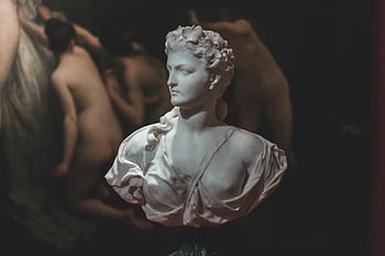 marble bust, white dress statue, classic art gallery, dimly lit, sculpture display, art gallery setting, marble sculpture, bust sculpture, classic sculpture, white dress, art gallery