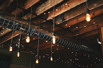 black pendant lamps, wooden ceiling, industrial hanging lights, exposed ductwork, modern rustic look, ceiling lights, rustic lighting, industrial lighting, modern lighting, rustic ceiling, industrial ceiling