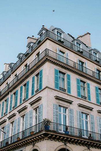 windows with shutters, classic urban building, blue shutters, elegant architecture, corner view, balcony, French architecture, Parisian style, shutters, building facade, windows