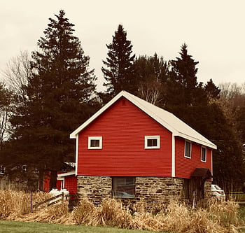 red barn, stone foundation, rural countryside, surrounded trees, quaint house, wooden house, brick house, red brown white, countryside setting, rural setting, barn house