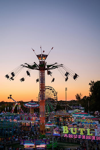 fair-at-sunset-colorful-fairground-rides-attractions-at-sunset-boise-id-lively-atmosphere-exciting-atmosphere-fairground-attractions-sunset-fair-amusement-park-rides-fairground-thumbnail.jpg