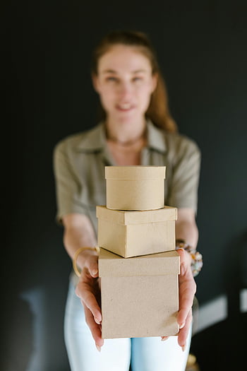 e-commerce, small business, cardboard boxes, online shopping, product packaging, shipping supplies, female entrepreneur, business owner, business success, online store, delivery