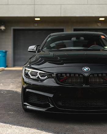 black BMW, sedan, parked, garage doors, urban area, close-up, car, vehicle, front view, building, street