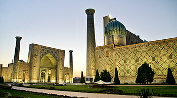 Registan complex, Samarkand, twilight, illuminated architecture, intricate design, mosque facade, Uzbekistan, minarets, domes, historical site, cultural landmark