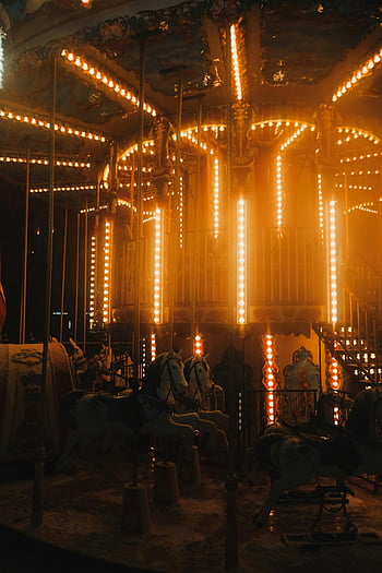 illuminated carousel, dusk, amusement park, magic, evening lights, carousel horses, night scene, vintage carousel, festive lights, amusement rides, carousel ride
