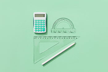 school supplies, green background, calculator, rulers, pencil, minimalist flat lay, educational tools, stationery items, math tools, study materials, office supplies